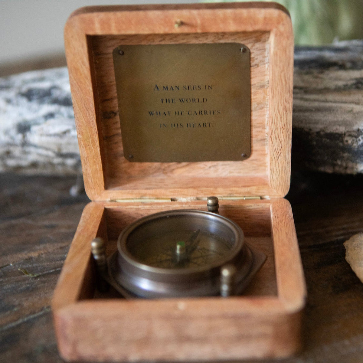 A Man Sees Tripod Compass in Wooden Box