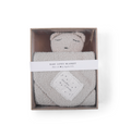 a white Bear Baby Lovey Blanket in a box